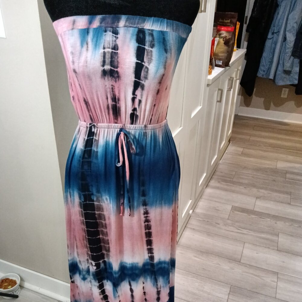 A new knit strapless maxi sundress covered in a blue and rose tie dye print.